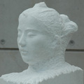 image: A work of a female head made of various materials:1