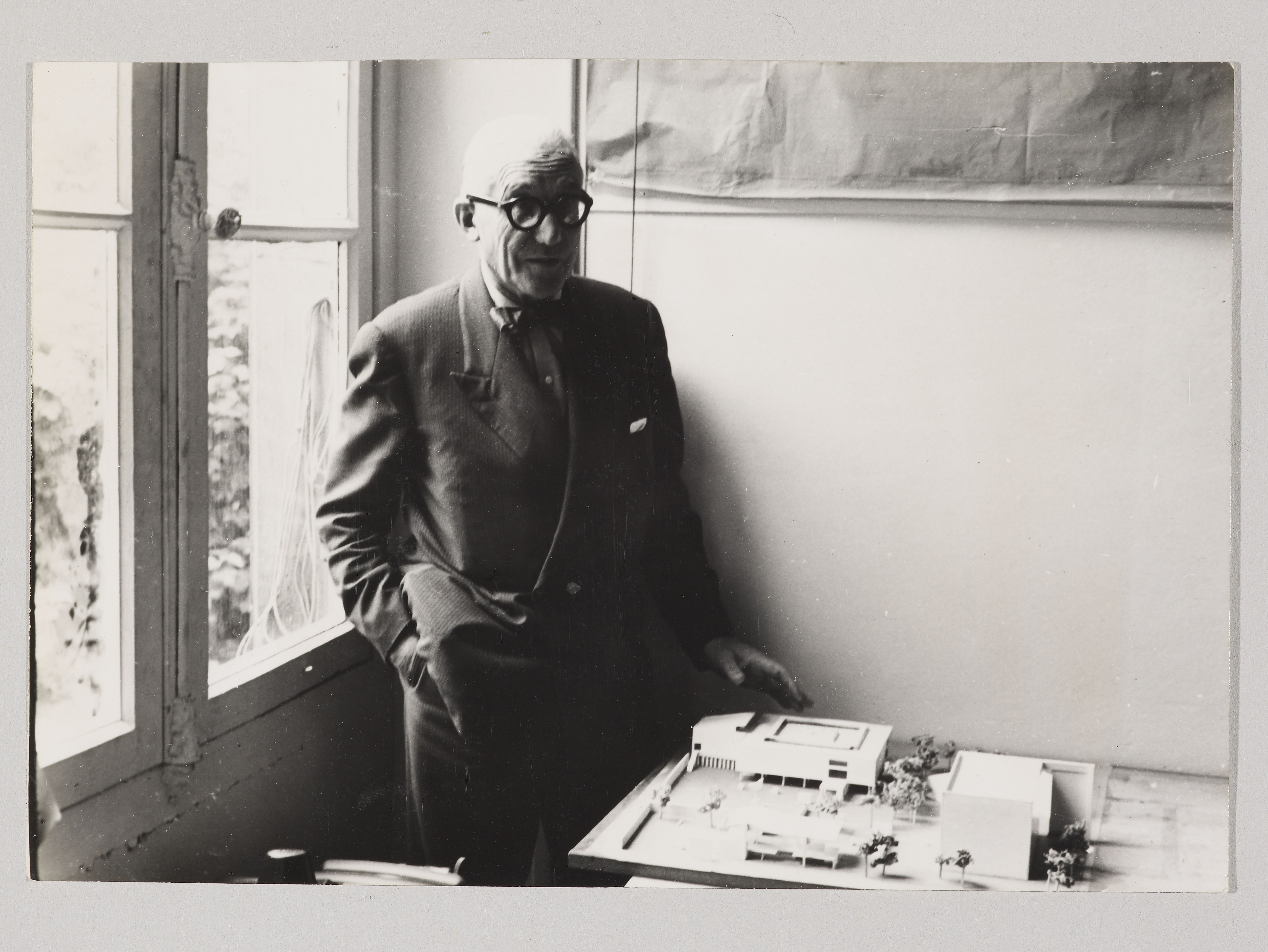 image: Le Corbusier with a model of the National Museum of Western Art, 1956