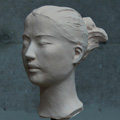 image: A work of a female head made of various materials:3