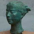 image: A work of a female head made of various materials:2